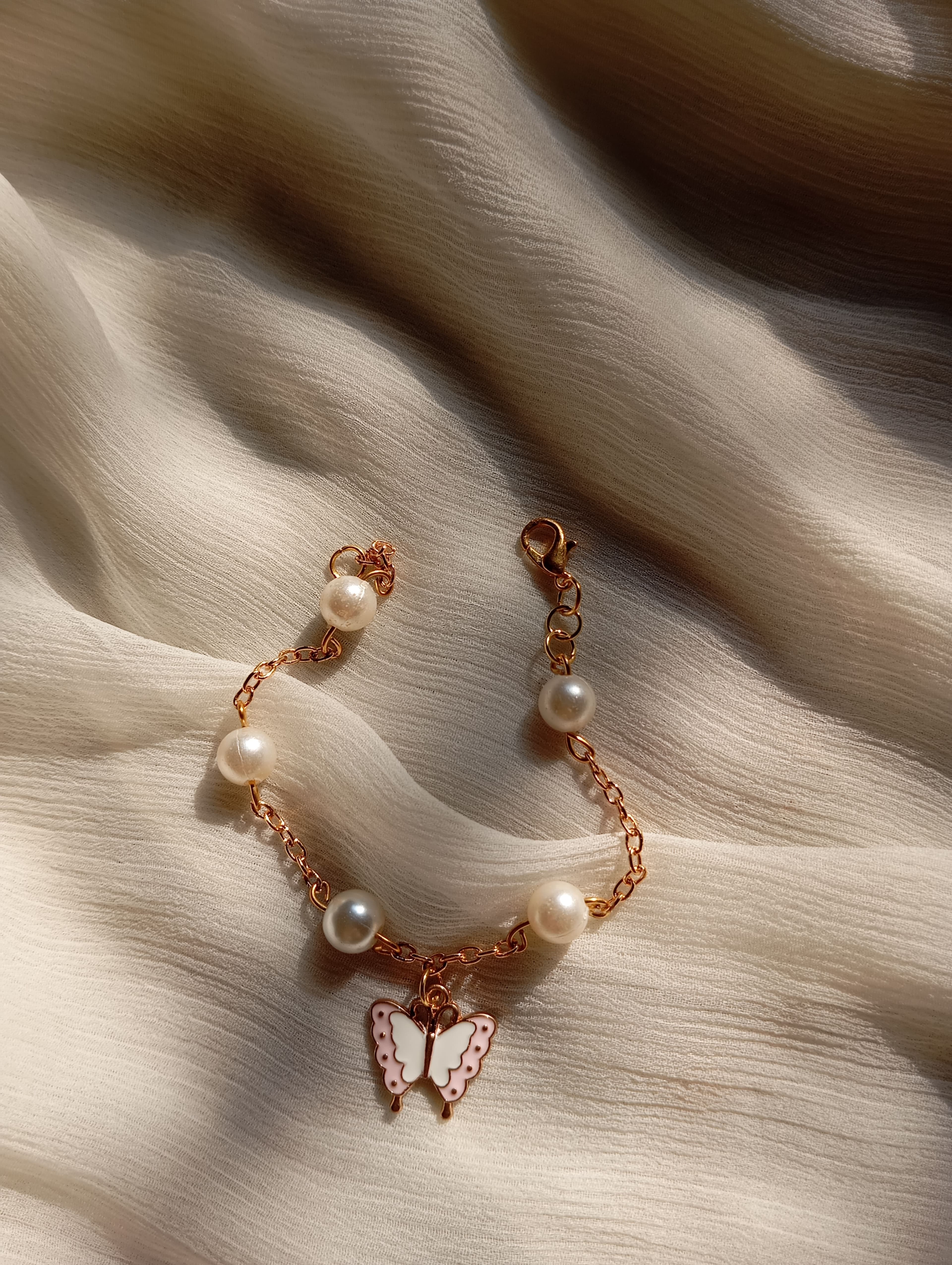 Pearl Butterfly Bracelet on cream chiffon